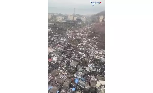 This image taken from video released by the Gendarmerie Nationale, shows massive damage from Cyclone Chido in the French territory of Mayotte, Sunday, Dec. 15, 2024. (Gendarmerie Nationale via AP)