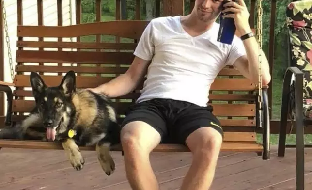 In this undated photo, Travis Timmerman sits on a porch swing in Urbana, Mo. (Stacey Collins Gardiner via AP)