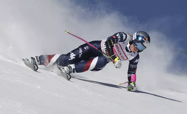 United States' Lindsey Vonn competes in an alpine ski, women's World Cup super G, in St. Moritz, Switzerland, Saturday, Dec. 21, 2024. (AP Photo/Marco Trovati)
