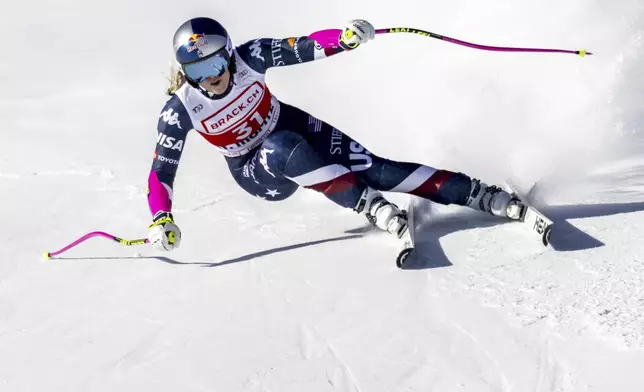 United States' Lindsey Vonn competes in an alpine ski, women's World Cup super G, in St. Moritz, Switzerland, Saturday, Dec. 21, 2024.(Jean-Christophe Bott/Keystone via AP)