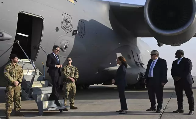 US Secretary of State Antony Blinken, second left, is welcomed by US officials upon landing in Baghdad, Iraq, Friday, Dec. 13, 2024. (Andrew Caballero-Reynolds/Pool Photo via AP)