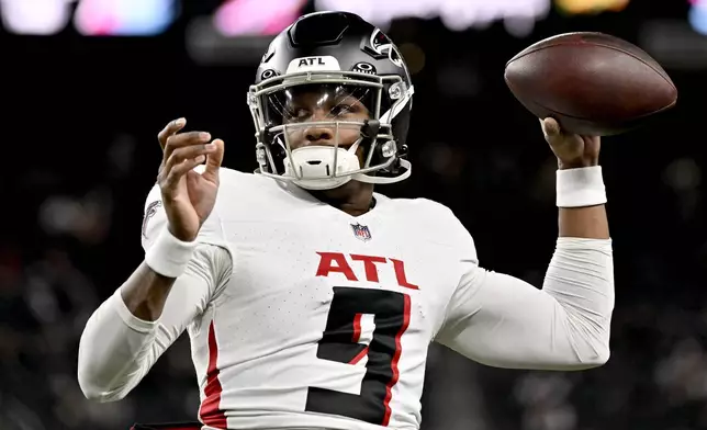 FILE - Atlanta Falcons quarterback Michael Penix Jr. warms up prior to an NFL football game against the Las Vegas Raiders, Monday, Dec. 16, 2024, in Las Vegas. (AP Photo/David Becker, File)