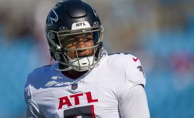 FILE - Atlanta Falcons quarterback Michael Penix Jr. (9) warms up before an NFL football game against the Carolina Panthers on Sunday, Oct. 13, 2024, in Charlotte, N.C. (AP Photo/Rusty Jones, File)