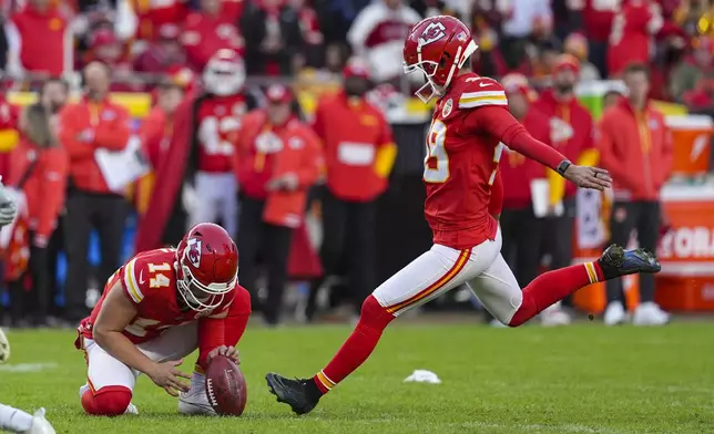 Kansas City Chiefs kicker Matthew Wright (49) kicks a field goal from the hold of Matt Araiza during the second half of an NFL football game against the Las Vegas Raiders in Kansas City, Mo., Friday, Nov. 29, 2024. (AP Photo/Charlie Riedel)