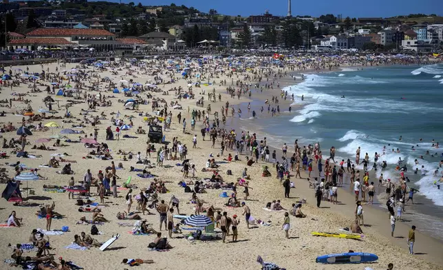 People celebrate Christmas Day at Bondi Beach in Sydney, Wednesday, Dec. 25, 2024. (Bianca De Marchi/AAP Image via AP)