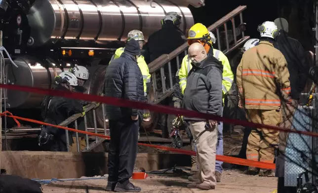 Rescue workers clear their equipment in order to take a different approach to their search for Elizabeth Pollard, who disappeared while looking for her cat in Marguerite, Pa., Wednesday, Dec. 4, 2024. (AP Photo/Gene J. Puskar)