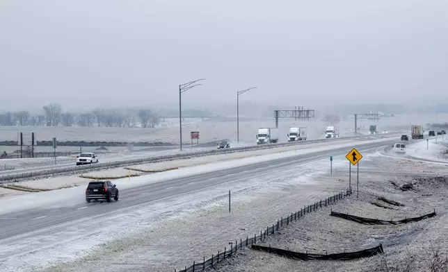 Motorists make their way along Interstate 380 in North Liberty, Iowa, on Saturday, Dec. 14, 2024. (Nick Rohlman/The Gazette via AP)