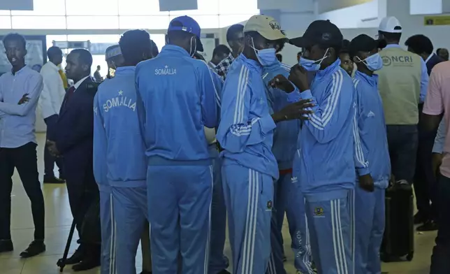 Survivors of a boat tragedy that killed dozens of Somali migrants off the coast of Madagascar arrive at Aden Adde International Airport in Mogadishu, Somalia, Saturday, Nov. 7, 2024. (AP Photo/Farah Abdi Warsameh)