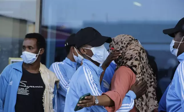 Survivors of a boat tragedy that killed dozens of Somali migrants off the coast of Madagascar arrive at Aden Adde International Airport in Mogadishu, Somalia, Saturday, Nov. 7, 2024. (AP Photo/Farah Abdi Warsameh)