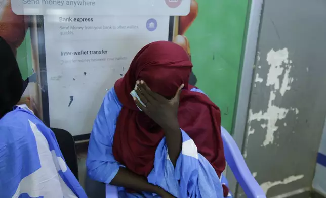 A survivor of the boat tragedy that killed dozens of Somali migrants off the coast of Madagascar arrives at Aden Adde International Airport in Mogadishu, Somalia, Saturday, Nov. 7, 2024. (AP Photo/Farah Abdi Warsameh)