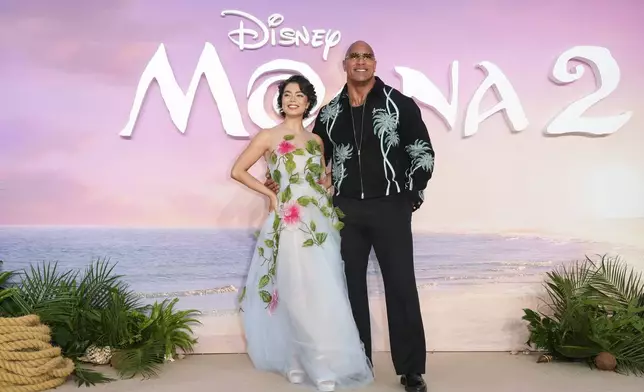 Auli'i Cravalho, left and Dwayne Johnson pose for photographers upon arrival at the UK premiere of Moana 2 on Sunday, Nov. 24, 2024, at a central London cinema. (Photo by Scott A Garfitt/Invision/AP)