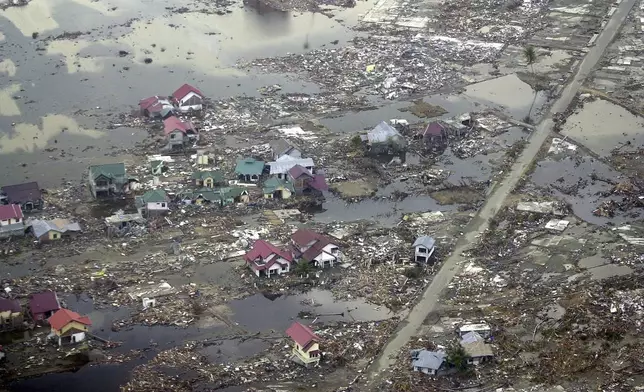 Destroyed houses are seen in this aerial view of the town of Meulaboh in Aceh province, Indonesia, which was flattened by tidal waves, on Saturday, Jan. 1, 2005. (AP Photo/Dudi Anung, File)