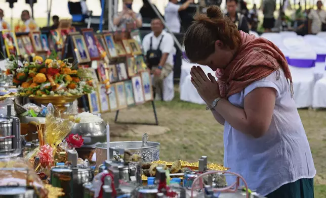 A relative of a victim of a 2004 Indian Ocean tsunami participates in its 20th anniversary at Tsunami Memorial Park at Ban Nam Khem, Takuapa district of Phang Nga province, southern Thailand, Thursday, Dec. 26, 2024. (AP Photo/Wason Wanichakorn)