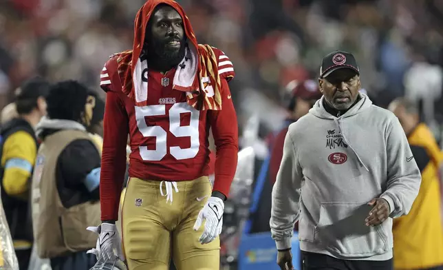 San Francisco 49ers' De'Vondre Campbell walks to the locker room during the second half of an NFL football game against the Los Angeles Rams in Santa Clara, Calif., Thursday, Dec. 12, 2024. (Scott Strazzante/San Francisco Chronicle via AP)