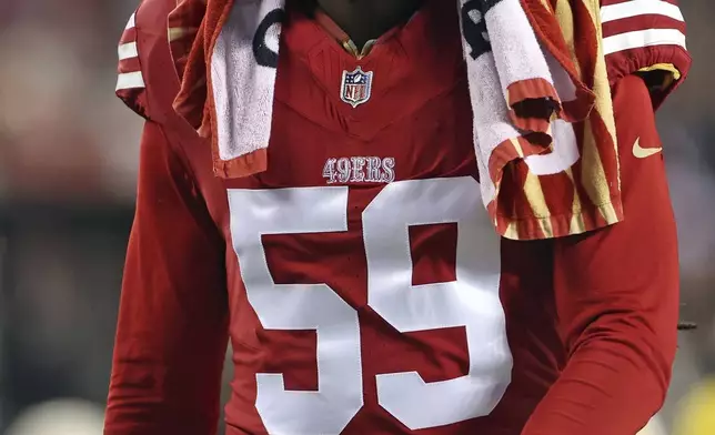 San Francisco 49ers' De'Vondre Campbell walks to the locker room during the second half of an NFL football game against the Los Angeles Rams in Santa Clara, Calif., Thursday, Dec. 12, 2024. (Scott Strazzante/San Francisco Chronicle via AP)