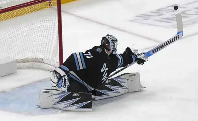 Utah Hockey Club goaltender Karel Vejmelka (70) makes a save against the Dallas Stars during the first period of an NHL hockey game Monday, Dec. 2, 2024, in Salt Lake City. (AP Photo/Rick Bowmer)