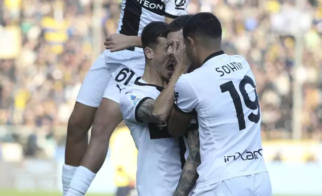 Parma's Dennis Man celebrates a goal during the Serie A soccer match between Parma and Lazio at Parma's Ennio Tardini Stadium, Sunday, Dec. 1, 2024. (Gianni Santandrea/LaPresse via AP)