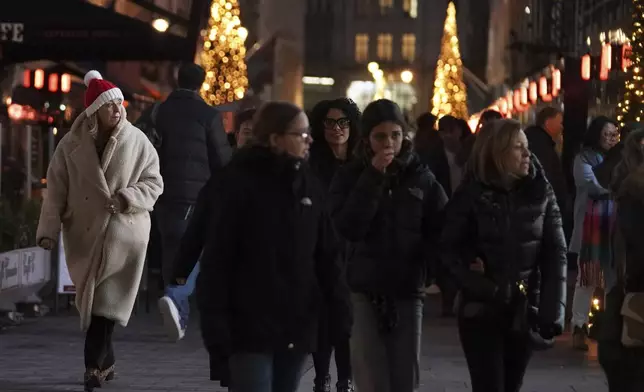 Christmas shoppers in central London, Friday, Dec. 13, 2024, Britain's economy unexpectedly shrank by 0.1 percent in October, The Office for National Statistics stated in figures released Friday. (AP Photo/Alberto Pezzali)