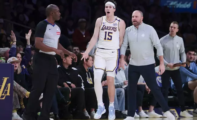 Los Angeles Lakers guard Austin Reaves (15) reacts after a three-point basket during the first half of an NBA basketball game against the Memphis Grizzlies, Sunday, Dec. 15, 2024, in Los Angeles. (AP Photo/Jessie Alcheh)