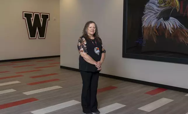 Indian Education Director Hollie Youngbear poses for a portrait at Watonga High School on Wednesday, Oct. 2, 2024, in Watonga, Okla. (AP Photo/Nick Oxford)