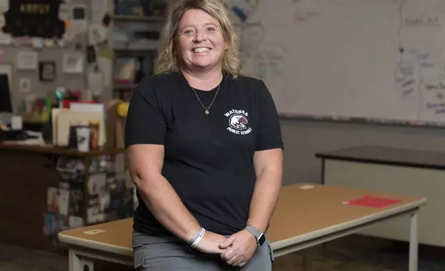 Alternative Education Director Carrie Compton poses for portrait in her classroom at Watonga High School on Wednesday, Oct. 2, 2024, in Watonga, Okla. When students do not show up for school, Compton and Indian Education Director Hollie Youngbear take turns visiting their homes. (AP Photo/Nick Oxford)