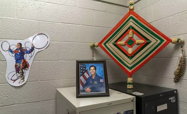 Decor adorns the corner of Indian Education Director Hollie Youngbear's office at Watonga High School Wednesday, Oct. 2, 2024, in Watonga, Okla. (AP Photo/Nick Oxford)