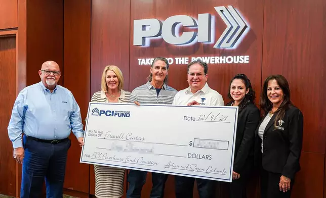 PCI Founders Arturo and Susan Echarte (second and third left) present Andy Fernandez (third right), Firewall Centers Inc.'s CEO, Rachel Taylor, Firewall Centers Inc.'s Finance Director, and Nancy Chevres, Firewall Centers Inc.'s CPO, with a grant to further their organization's mission. Looking on (at left) is Ismael Diaz, PCI's President &amp; CEO. (Photo: Business Wire)