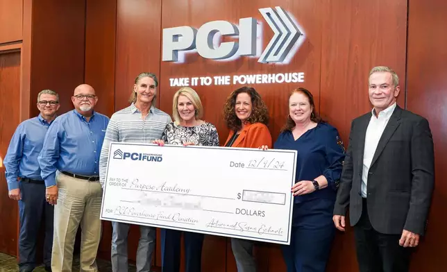 Purpose Academy's contingent of Naomi Peyton (third right), Principal, Tammy J Hoskins (second right), Board Secretary, and David Salvatelli (right), Superintendent, share a photo opportunity with PCI's Executives and Founders after being given a grant to further their organization's mission. From left are Dennis R. Garcia, PCI Executive VP &amp; CFO, Ismael Diaz, President &amp; CEO, and Founders Arturo and Susan Echarte. (Photo: Business Wire)