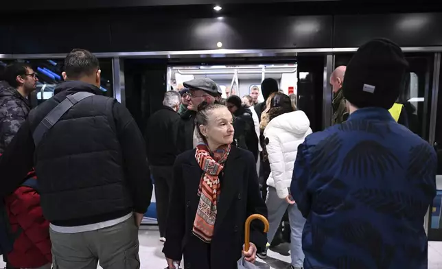 Commuters at a metro station during the inauguration day of the Thessaloniki metro, in Thessaloniki, northern Greece, Saturday, Nov. 30, 2024. (AP Photo/Giannis Papanikos)