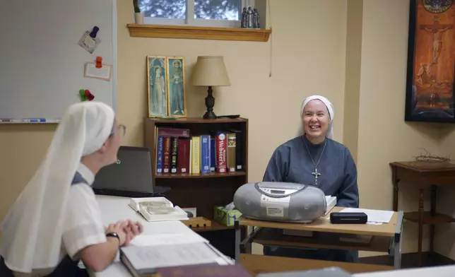 Sister Mary Gemma Harris, right, leads a class for novices at the motherhouse of the Franciscan Sisters, T.O.R. of Penance of the Sorrowful Mother, in Toronto, Ohio, Thursday, Nov. 7, 2024. (AP Photo/Jessie Wardarski)
