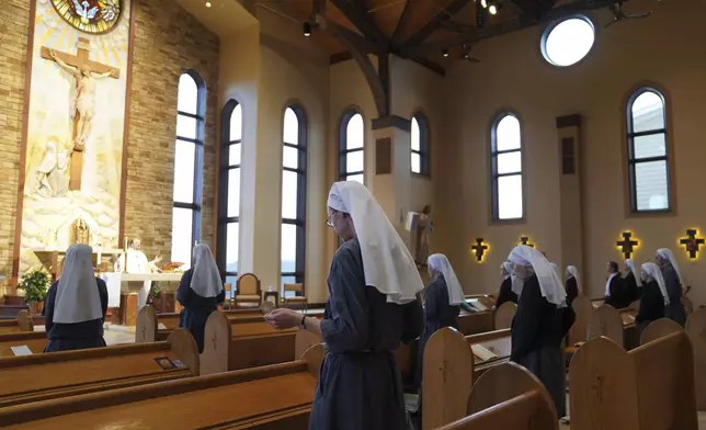 The Franciscan Sisters, T.O.R. of Penance of the Sorrowful Mother stand during Mass in Toronto, Ohio, Thursday, Nov. 7, 2024. (AP Photo/Jessie Wardarski)