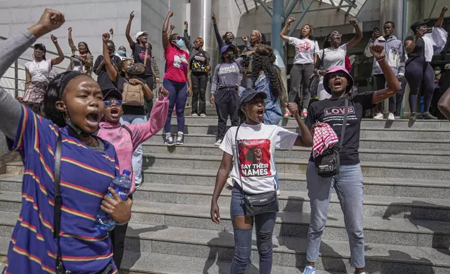 Protesters chant during a march against the rising cases of femicide, in downtown Nairobi, Kenya, Tuesday, Dec. 10, 2024. (AP Photo/Brian Inganga)