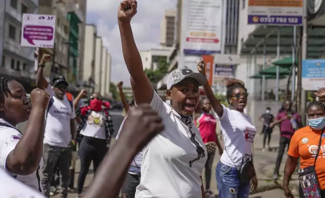 Demonstrators chant during the march against the rising cases of femicide, in downtown Nairobi, Kenya, Tuesday, Dec. 10, 2024. (AP Photo/Brian Inganga)