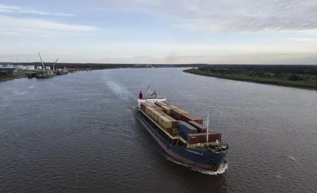 A container ship navigates the Paraguay River near the port of Villeta on the outskirts of Asuncion, Paraguay, Wednesday, July 10, 2024. (AP Photo/Rodrigo Abd)