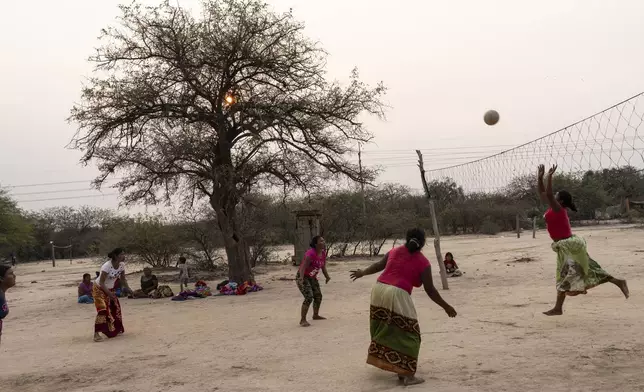 Manjui Indigenous women play volleyball in the Abisai community of Mariscal Estigarribia, in the western region of Paraguay known as the Paraguayan Chaco, Wednesday, Aug. 28, 2024. (AP Photo/Rodrigo Abd)