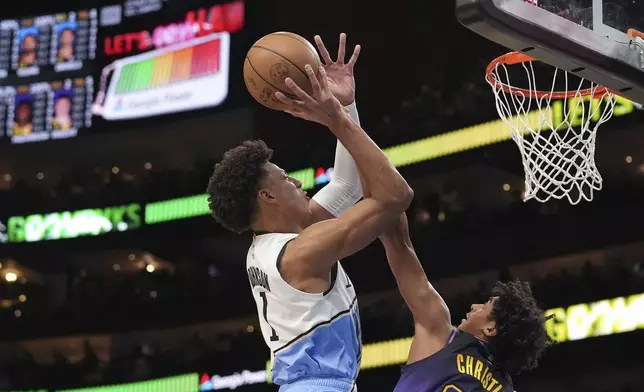 Atlanta Hawks forward Jalen Johnson (1) shoots and scores in the first half of an NBA basketball game against the Los Angeles Lakers, Friday, Dec. 6, 2024, in Atlanta. (AP Photo/Brynn Anderson)