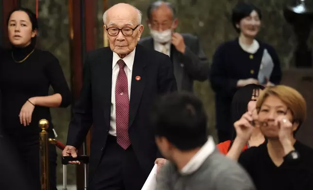 Terumi Tanaka, one of representatives of this year's Nobel Peace Prize winner Nihon Hidankyo, or the Japan Confederation of A- and H-Bomb Sufferers Organizations, arrives for a press conference at Japan National Press Club Tuesday, Dec. 24, 2024, in Tokyo. (AP Photo/Eugene Hoshiko)