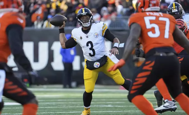 Pittsburgh Steelers quarterback Russell Wilson (3) prepares to pass to tight end Pat Freiermuth (not shown) for a touchdown during the second half of an NFL football game against the Cincinnati Bengals, Sunday, Dec. 1, 2024, in Cincinnati. (AP Photo/Joshua A. Bickel)