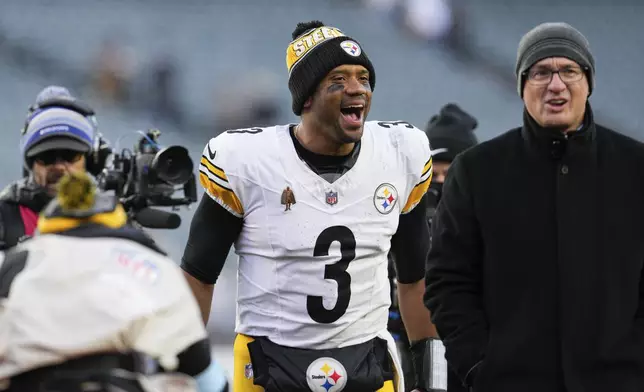 Pittsburgh Steelers quarterback Russell Wilson (3) celebrates as he walks off the field following his team's victory over the Cincinnati Bengals in an NFL football game Sunday, Dec. 1, 2024, in Cincinnati. (AP Photo/Jeff Dean)