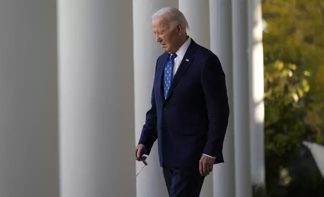 FILE - President Joe Biden walks out to speak in the Rose Garden of the White House in Washington, Nov. 26, 2024. (AP Photo/Ben Curtis, file)