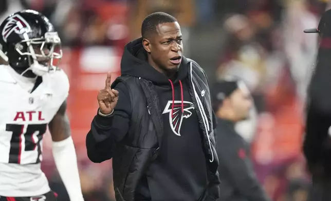 Atlanta Falcons head coach Raheem Morris walks on the field before an NFL football game against the Washington Commanders, Sunday, Dec. 29, 2024, in Landover. (AP Photo/Stephanie Scarbrough)