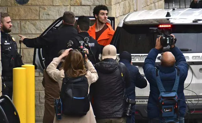 Suspect Luigi Mangione is taken into the Blair County Courthouse on Tuesday, Dec. 10, 2024, in Hollidaysburg, Pa. (Janet Klingbeil via AP)