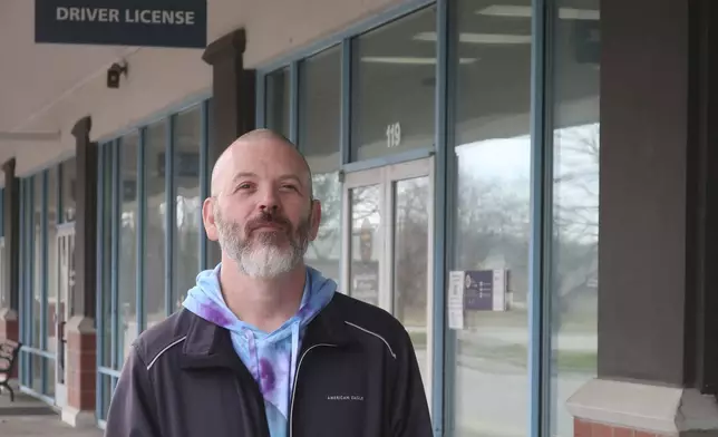 Steven Fish, of Garnett, Kan., returns to the strip mall where he tried to register to vote in 2014 but couldn’t because of a proof-of-citizenship requirement later struck down by the federal courts, Monday, Dec. 9, 2024, in Lawrence, Kan. (AP Photo/John Hanna)