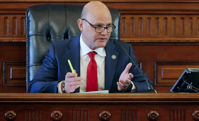 Kansas Secretary of State Scott Schwab makes remarks during a meeting of the state’s presidential electors, Tuesday, Dec. 17, 2024, in the Senate chamber at the Statehouse in Topeka, Kan. Schwab championed a law requiring new voters to show proof of their U.S. citizenship when registering before it was struck down by the federal courts, but now opposes the idea, saying, “It didn’t work out so well.” (AP Photo/John Hanna)