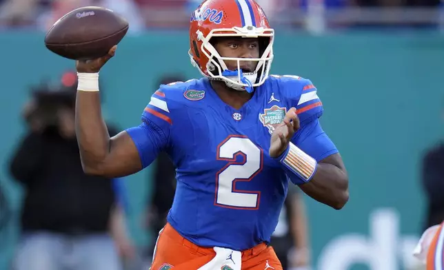 Florida quarterback DJ Lagway (2) throws a pass against Tulane during the first half of the Gasparilla Bowl NCAA college football game Friday, Dec. 20, 2024, in Tampa, Fla. (AP Photo/Chris O'Meara)