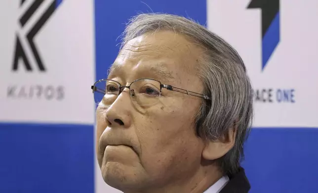 Space One President Masakazu Toyoda reacts during a press conference after its second attempt to launch the Kairos No. 2 rocket carrying satellites into orbit had been aborted minutes after liftoff, in Kushimoto town, western Japan Wednesday, Dec. 18, 2024.(Kyodo News via AP)