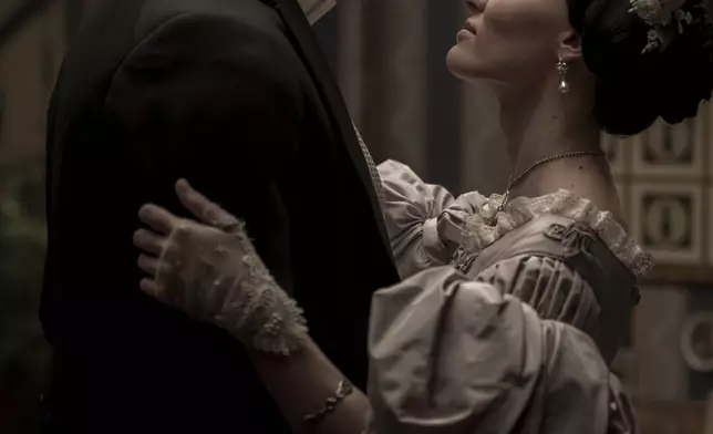 This imaged released by Focus Features shows Nicholas Hoult, left, and Lily-Rose Depp in a scene from "Nosferatu". (Focus Features via AP)