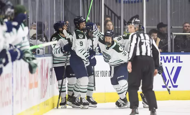 Boston Fleet's Loren Gabel (36) celebrates with teammates after scoring against the Toronto Sceptres during second period PWHL hockey in Toronto, Friday, Dec. 27, 2024. (Christopher Katsarov/The Canadian Press via AP)