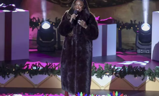 Singer-songwriter Coco Jones participates in the Rockefeller Center Christmas tree lighting ceremony on Wednesday, Dec. 4, 2024, in New York. (Photo by Andy Kropa/Invision/AP)