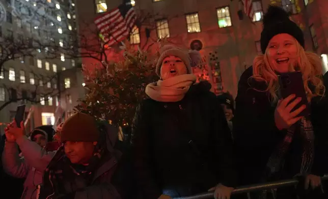 People arrive for the 92nd annual Rockefeller Center Christmas Tree lighting ceremony, Wednesday, Dec. 4, 2024, in New York. (AP Photo/Julia Demaree Nikhinson)